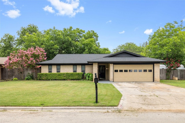 2507 16th St, Brownwood, TX 76801 - single story home featuring a garage, driveway, brick siding, and a shingled roof