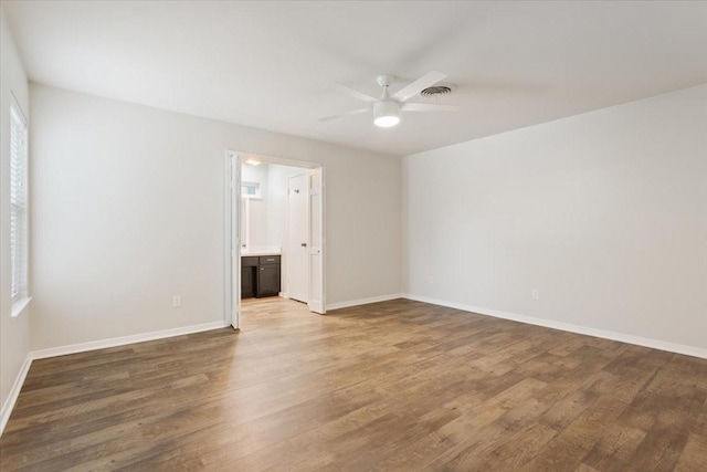 3201 Carroll Dr, Waco, TX 76708 - spare room featuring ceiling fan, wood finished floors, and baseboards