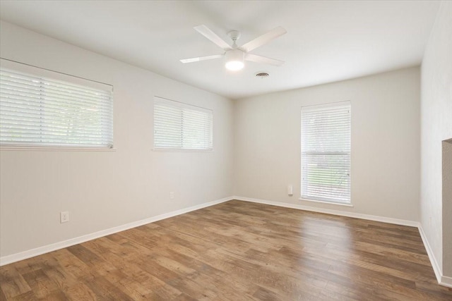 3201 Carroll Dr, Waco, TX 76708 - spare room with healthy amount of natural light, wood finished floors, and ceiling fan