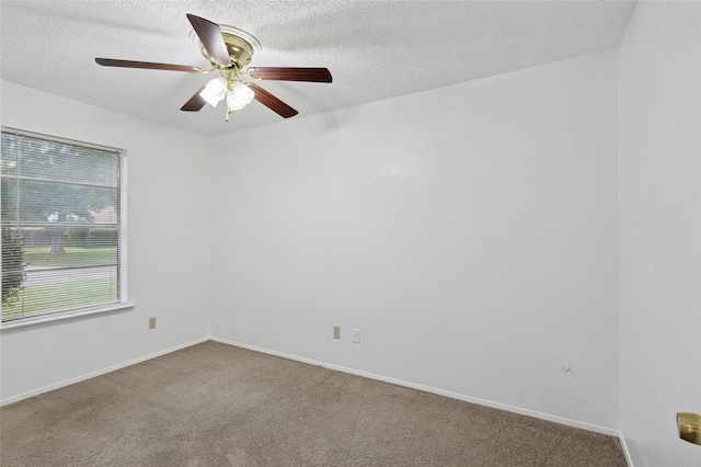 6003 Springwood Dr, Arlington, TX 76001 - spare room with carpet flooring, a ceiling fan, a textured ceiling, and baseboards
