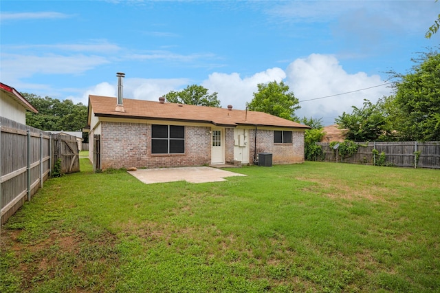 6003 Springwood Dr, Arlington, TX 76001 - rear view of property featuring brick siding, a patio, and central AC