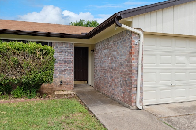 6003 Springwood Dr, Arlington, TX 76001 - view of exterior entry featuring an attached garage and brick siding