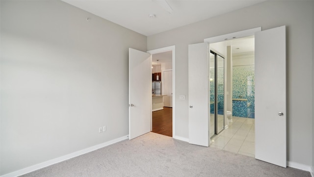 2950 Mckinney Ave Unit 316, Dallas, TX 75204 - unfurnished bedroom featuring carpet and baseboards