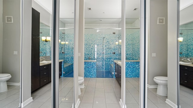 2950 Mckinney Ave Unit 316, Dallas, TX 75204 - bathroom featuring toilet, vanity, and a stall shower