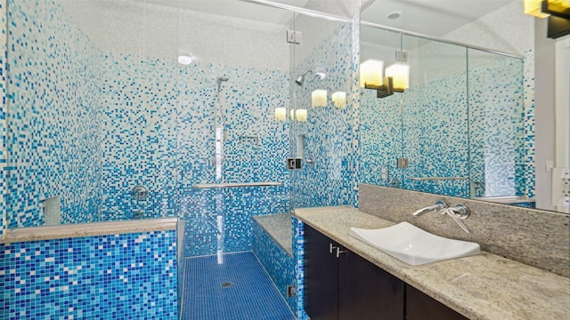 2950 Mckinney Ave Unit 316, Dallas, TX 75204 - full bath featuring tile walls, vanity, and a shower stall