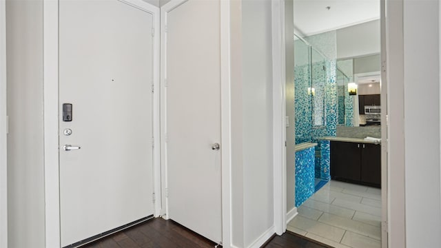 2950 Mckinney Ave Unit 316, Dallas, TX 75204 - hallway with dark wood-style flooring