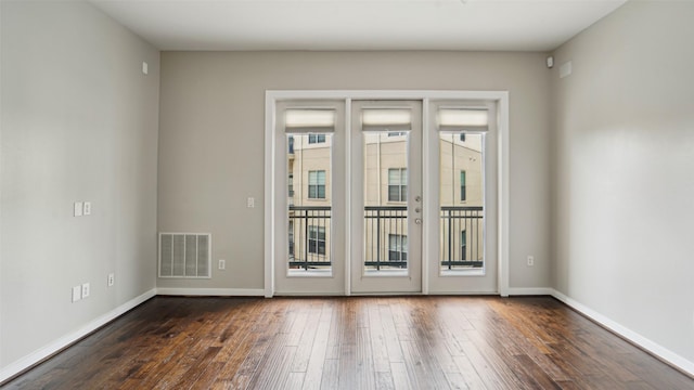 2950 Mckinney Ave Unit 316, Dallas, TX 75204 - unfurnished room featuring dark wood-style flooring and baseboards