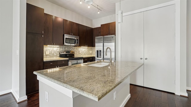 2950 Mckinney Ave Unit 316, Dallas, TX 75204 - kitchen with appliances with stainless steel finishes, a sink, dark wood-style floors, and tasteful backsplash