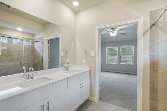414 Stagg St, Mckinney, TX 75069 - bathroom featuring a shower stall, double vanity, a ceiling fan, tile patterned flooring, and baseboards
