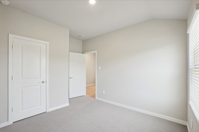 414 Stagg St, Mckinney, TX 75069 - unfurnished bedroom featuring carpet flooring, baseboards, and vaulted ceiling