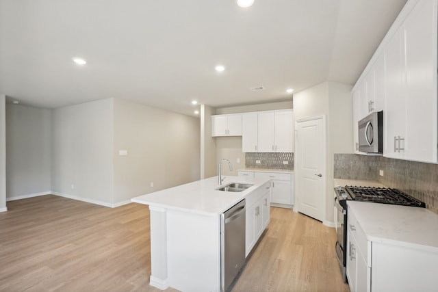 414 Stagg St, Mckinney, TX 75069 - kitchen featuring a sink, appliances with stainless steel finishes, light wood-type flooring, recessed lighting, and backsplash
