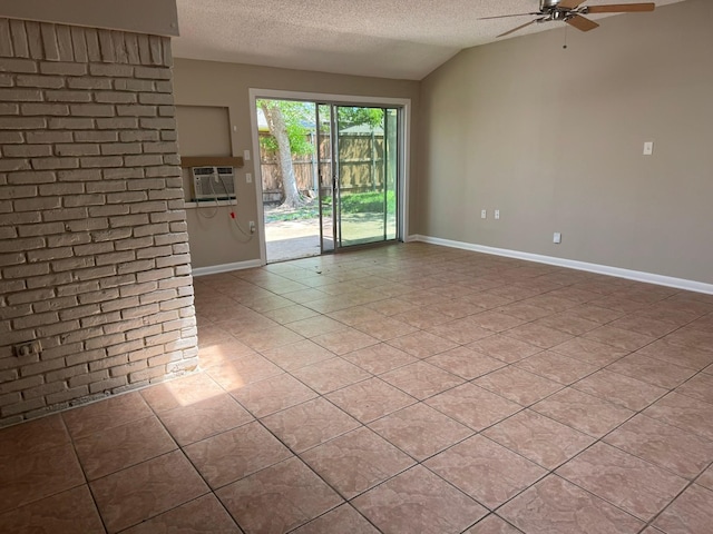 7750 Dentcrest Dr, Dallas, TX 75254 - unfurnished room featuring ceiling fan, a textured ceiling, baseboards, lofted ceiling, and a wall unit AC