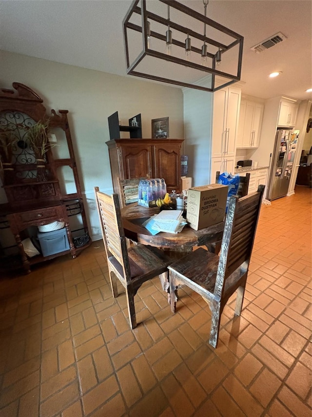 7750 Dentcrest Dr, Dallas, TX 75254 - dining area with brick floors and recessed lighting
