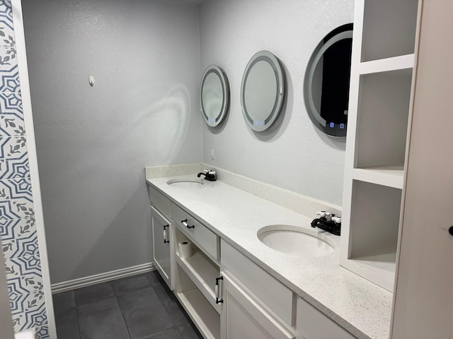 7750 Dentcrest Dr, Dallas, TX 75254 - bathroom featuring double vanity, tile patterned floors, and baseboards