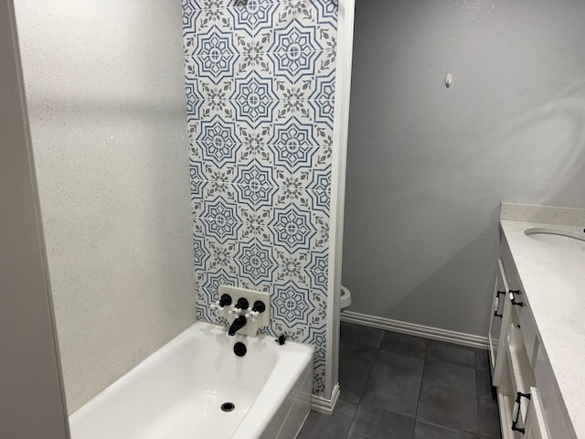 7750 Dentcrest Dr, Dallas, TX 75254 - full bathroom with toilet, a bathtub, vanity, tile patterned flooring, and baseboards