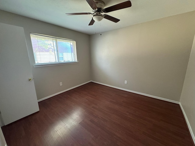 7750 Dentcrest Dr, Dallas, TX 75254 - spare room featuring dark wood finished floors, a ceiling fan, and baseboards