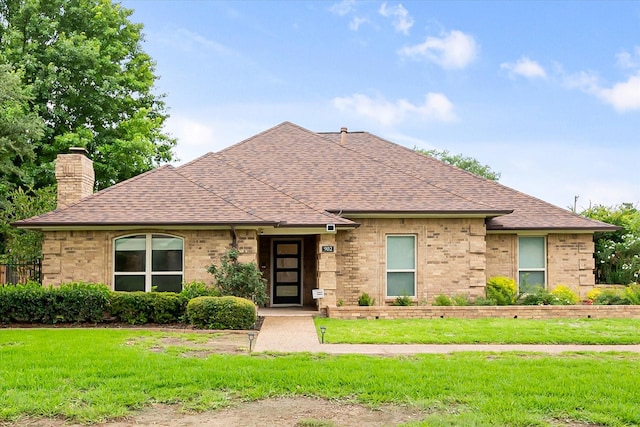 902 Mission Dr, Southlake, TX 76092 - view of front of home with a chimney, a shingled roof, a front lawn, and brick siding