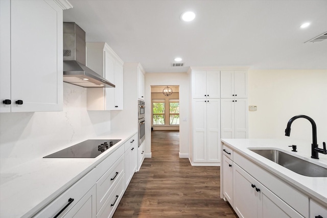 902 Mission Dr, Southlake, TX 76092 - kitchen with wall chimney range hood, a sink, black electric cooktop, dark wood-style floors, and recessed lighting