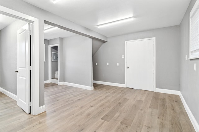 1025 Briar Way, Garland, TX 75043 - basement featuring light wood-style flooring and baseboards