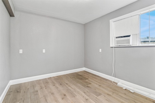 1025 Briar Way, Garland, TX 75043 - empty room featuring wood finished floors and baseboards