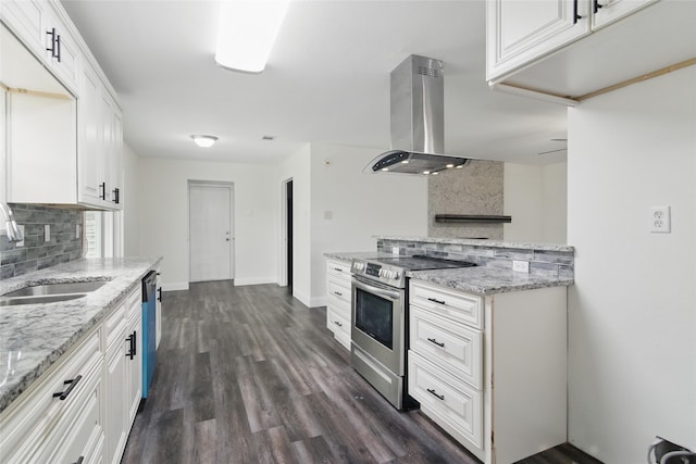 1025 Briar Way, Garland, TX 75043 - kitchen with island exhaust hood, stainless steel range with electric cooktop, a sink, backsplash, and white cabinetry