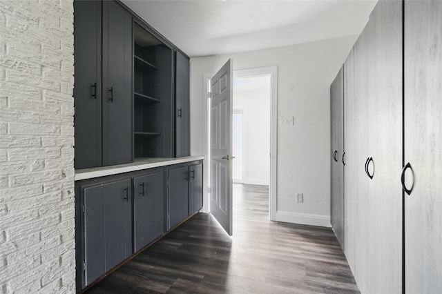 1025 Briar Way, Garland, TX 75043 - hallway with dark wood-type flooring and baseboards