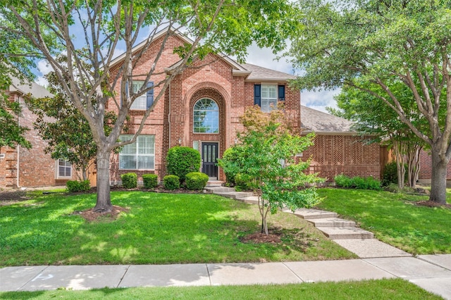 2362 Barret Dr, Frisco, TX 75033 - traditional home featuring brick siding, a front lawn, and roof with shingles