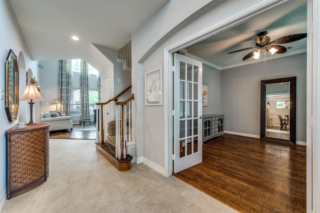 2362 Barret Dr, Frisco, TX 75033 - foyer with healthy amount of natural light, a ceiling fan, baseboards, stairway, and ornamental molding
