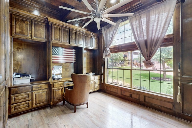 5720 County Road 1094, Celeste, TX 75423 - office space with light wood-style flooring, wooden ceiling with exposed beams, ceiling fan, wooden walls, and built in desk