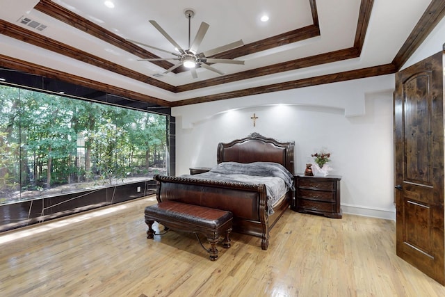 5720 County Road 1094, Celeste, TX 75423 - bedroom with ornamental molding, light wood-style flooring, a raised ceiling, baseboards, and a ceiling fan