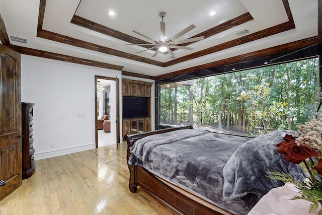 5720 County Road 1094, Celeste, TX 75423 - bedroom featuring a raised ceiling, light wood-type flooring, crown molding, baseboards, and ceiling fan