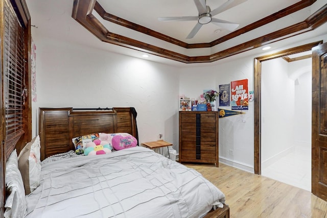 5720 County Road 1094, Celeste, TX 75423 - bedroom featuring wood finished floors, recessed lighting, arched walkways, a ceiling fan, and a tray ceiling