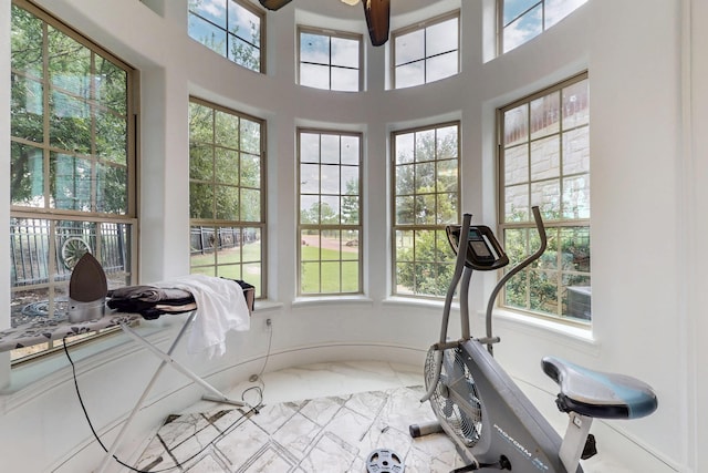 5720 County Road 1094, Celeste, TX 75423 - exercise area with marble look tile flooring, healthy amount of natural light, and ceiling fan