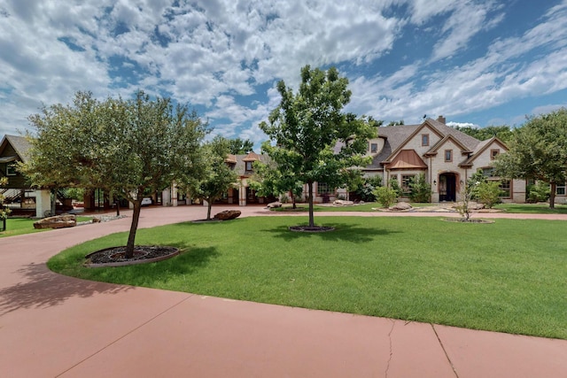 5720 County Road 1094, Celeste, TX 75423 - view of home's community with a yard and curved driveway