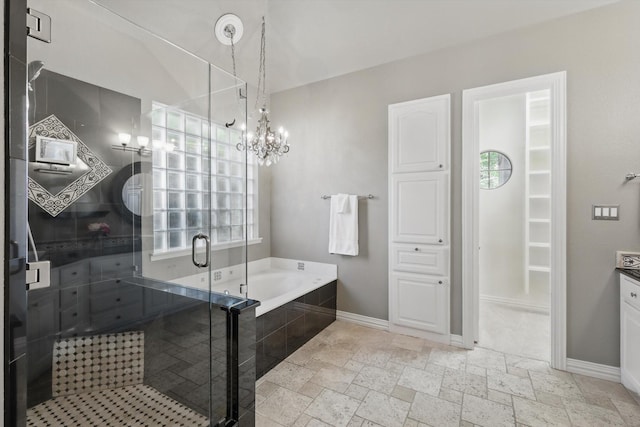 702 Malton Ln, Southlake, TX 76092 - full bathroom with a garden tub, a stall shower, stone tile floors, baseboards, and vanity