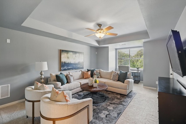 702 Malton Ln, Southlake, TX 76092 - carpeted living area with a tray ceiling, baseboards, and a ceiling fan