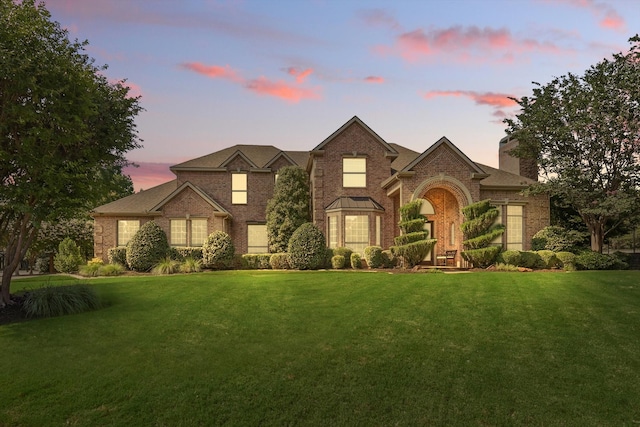 702 Malton Ln, Southlake, TX 76092 - traditional-style home with a front lawn, a chimney, and brick siding