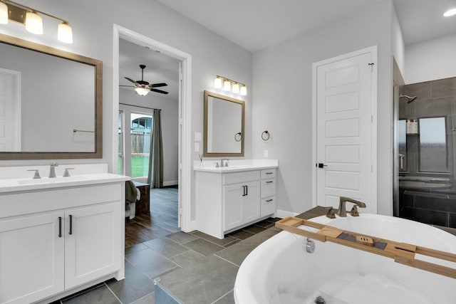 1210 Old Rocksprings Pass, Mansfield, TX 76063 - bathroom featuring two vanities, a soaking tub, ceiling fan, a shower stall, and tile patterned flooring