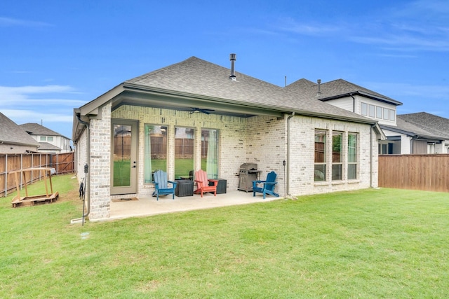 1210 Old Rocksprings Pass, Mansfield, TX 76063 - back of house featuring a ceiling fan, a patio area, roof with shingles, and brick siding