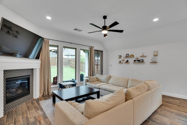 1210 Old Rocksprings Pass, Mansfield, TX 76063 - living room featuring a ceiling fan, a tile fireplace, dark wood-type flooring, recessed lighting, and vaulted ceiling