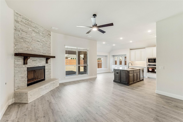 1078 Fleetwood, Justin, TX 76247 - living room with a ceiling fan, baseboards, light wood-style flooring, and recessed lighting