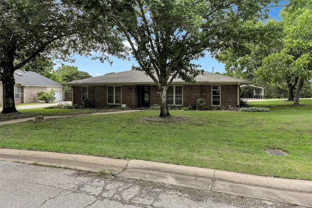1631 Idlewood Dr, Sherman, TX 75092 - ranch-style home with a front yard, brick siding, and a garage
