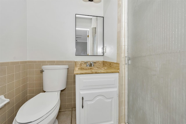1631 Idlewood Dr, Sherman, TX 75092 - full bathroom featuring toilet, tile walls, a stall shower, and vanity