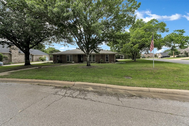1631 Idlewood Dr, Sherman, TX 75092 - view of front of home featuring a front yard and brick siding