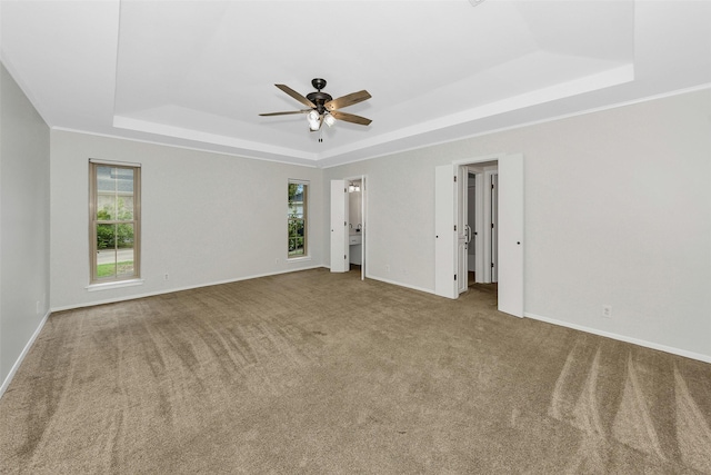 1631 Idlewood Dr, Sherman, TX 75092 - unfurnished room featuring a tray ceiling, ceiling fan, carpet floors, and baseboards