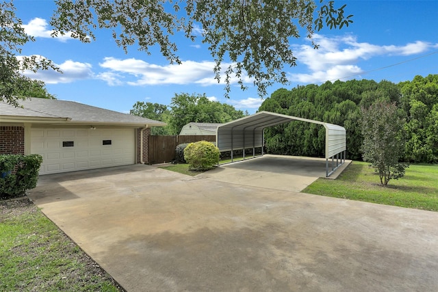 1631 Idlewood Dr, Sherman, TX 75092 - view of patio / terrace with driveway, a garage, and a detached carport