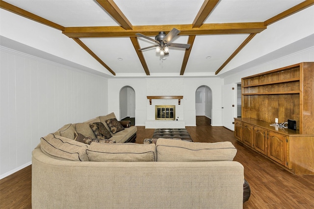 1631 Idlewood Dr, Sherman, TX 75092 - living room with arched walkways, ceiling fan, dark wood-type flooring, and baseboards
