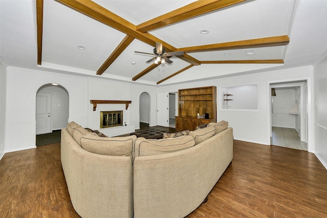 1631 Idlewood Dr, Sherman, TX 75092 - living area with arched walkways, a ceiling fan, baseboards, and wood finished floors
