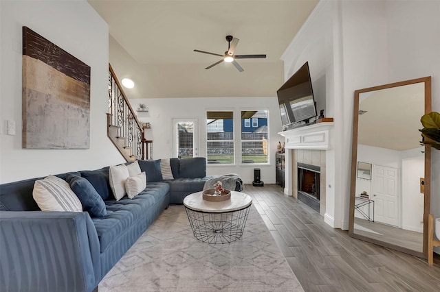 832 Lake Worth Trl, Little Elm, TX 75068 - living room with a ceiling fan, a fireplace, stairway, wood finished floors, and baseboards
