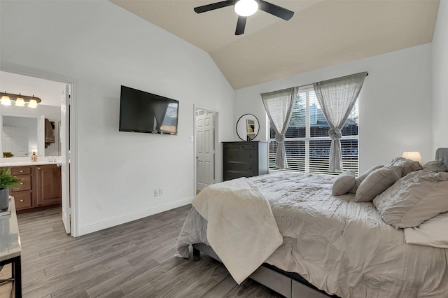 832 Lake Worth Trl, Little Elm, TX 75068 - bedroom featuring light wood-style flooring, baseboards, vaulted ceiling, ensuite bathroom, and a ceiling fan